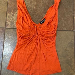 Bebe Orange plunge neck with gold bar top